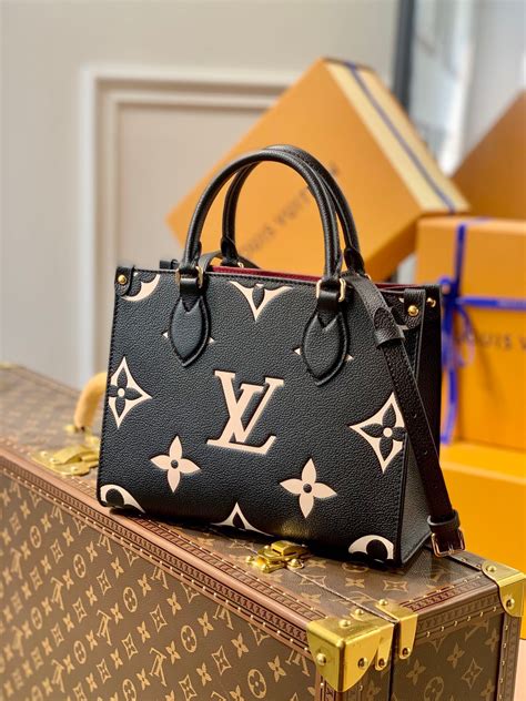 louis vuitton black and gold purse